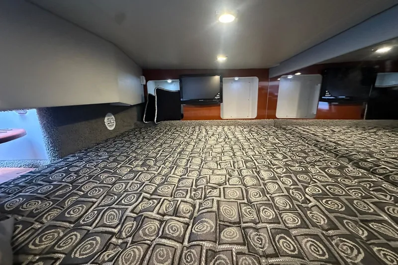 Slide: The Image of Interior cabin of 2012 Formula 350 FX6 with patterned bedding and ambient lighting. - 22