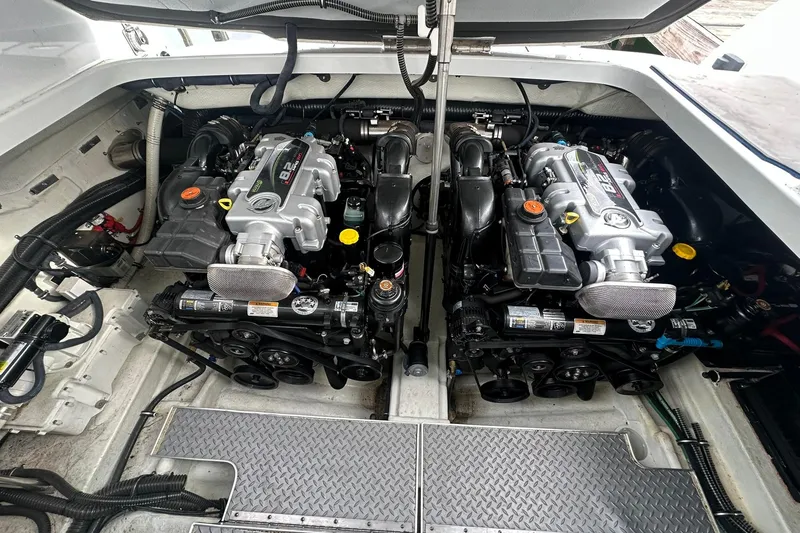 Slide: The Image of Engine compartment of a 2012 Formula 350 FX6 boat, showcasing dual powerful engines. - 24