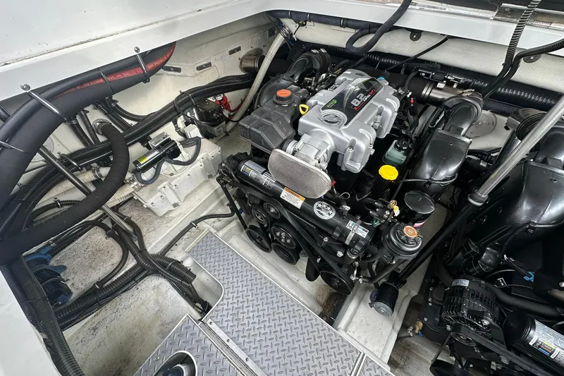 Slide: The Image of Engine compartment of a 2012 Formula 350 FX6 boat, showcasing detailed mechanical components. - 25