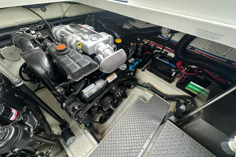 Slide: The Image of Engine compartment of a 2012 Formula 350 FX6 boat, showcasing detailed mechanical components. - 26