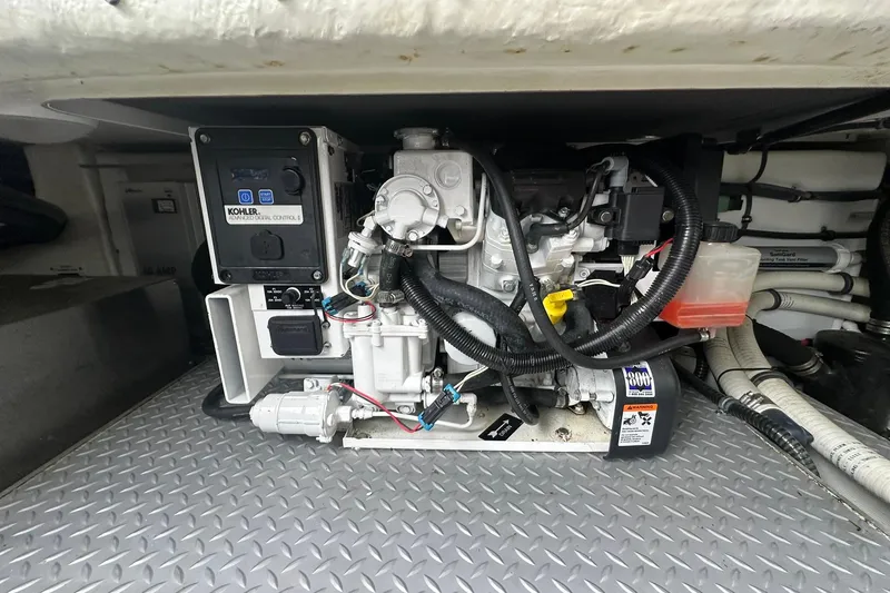 Slide: The Image of Engine compartment of a 2012 Formula 350 FX6 boat with Kohler generator. - 27