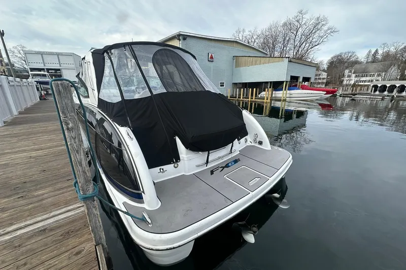 Slide: The Image of 2012 Formula 350 FX6 boat docked at a marina, covered and ready for use. - 3