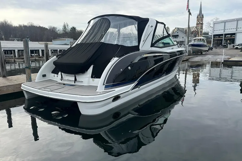 Slide: The Image of 2012 Formula 350 FX6 boat docked at marina, calm water reflection. - 4