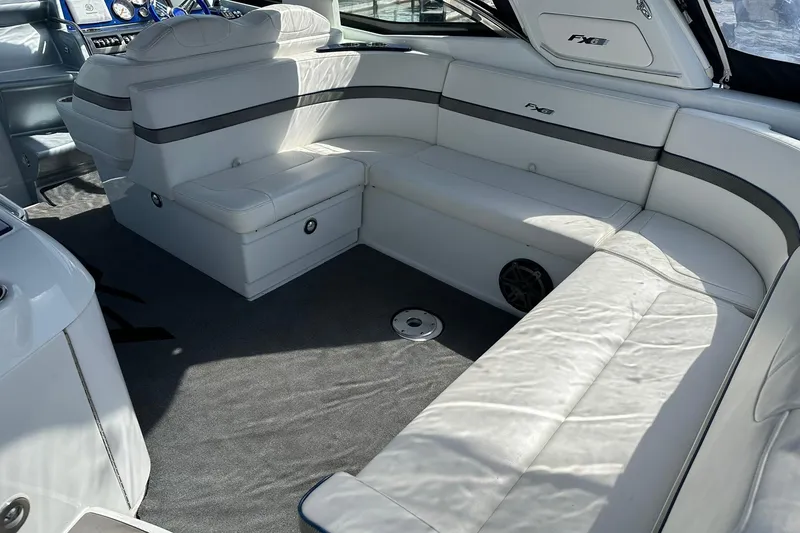 Slide: The Image of Luxurious interior of a 2012 Formula 350 FX6 boat with white leather seating. - 6