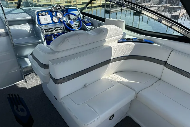 Slide: The Image of Luxurious interior of a 2012 Formula 350 FX6 boat with white seating and modern dashboard. - 7