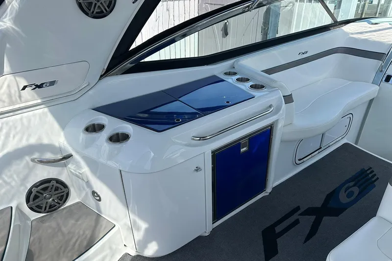 Slide: The Image of 2012 Formula 350 FX6 boat interior with seating and cup holders. - 8