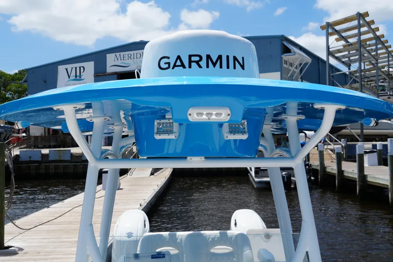 Slide: The Image of 2024 Twin Vee 240 GFX CC boat with Garmin equipment at marina dock. - 29