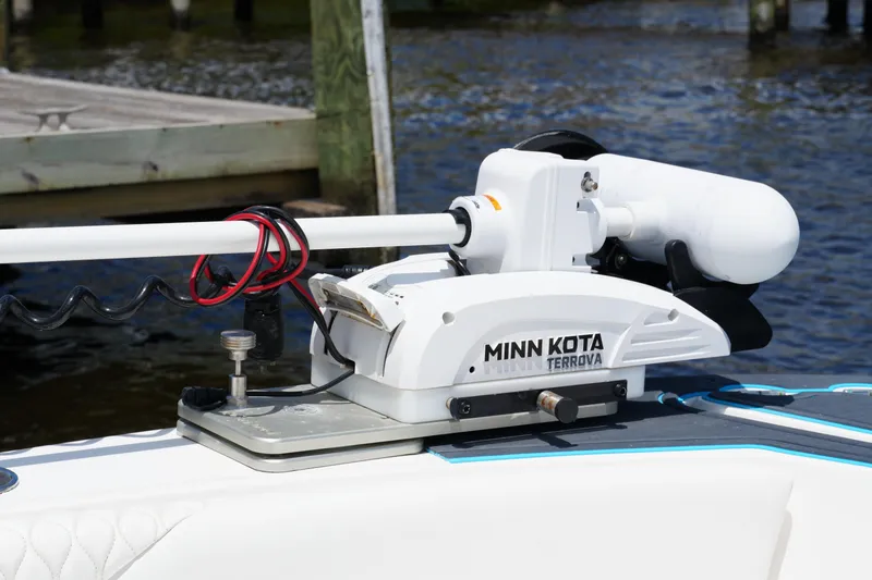 Slide: The Image of Minn Kota Terrova motor on 2024 Twin Vee 240 GFX CC boat, dockside view. - 30