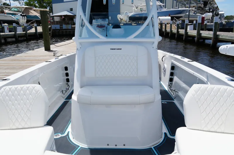 Slide: The Image of 2024 Twin Vee 240 GFX CC boat interior with white seating and modern design. - 35