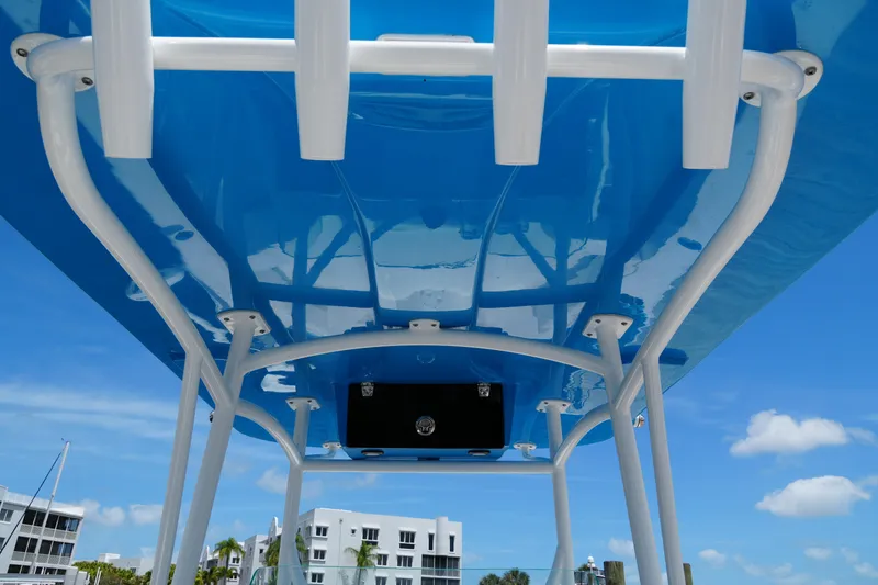 Slide: The Image of 2024 Twin Vee 240 GFX CC boat canopy with blue sky background. - 50