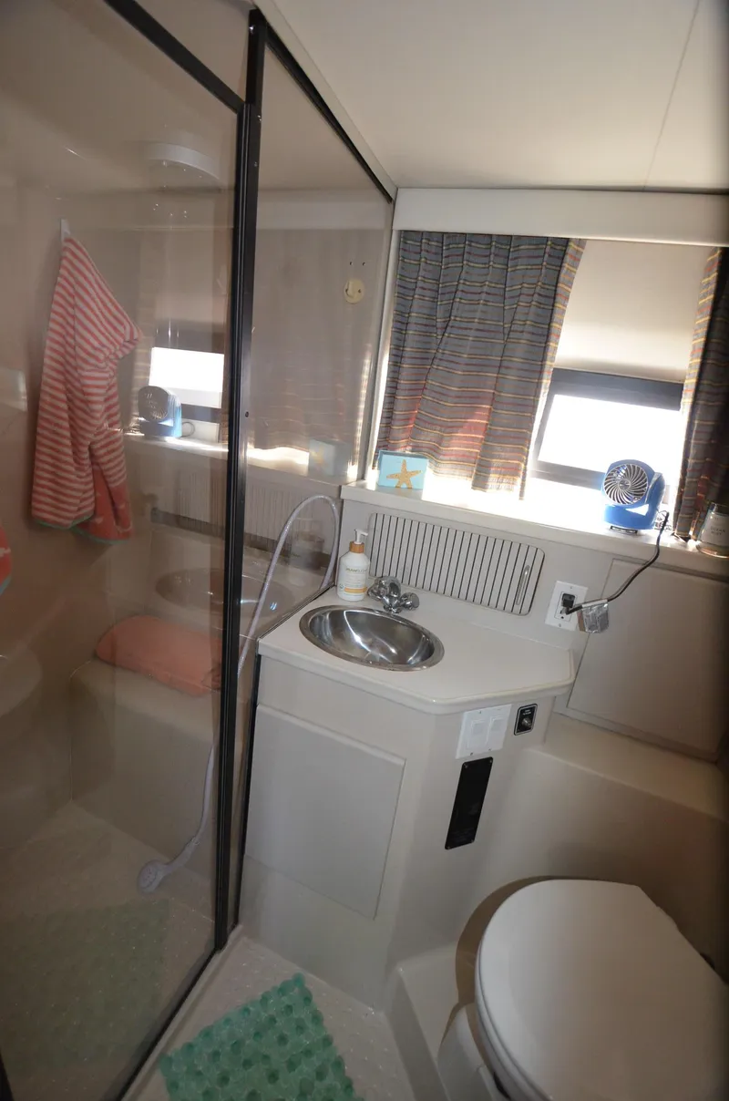 Slide: The Image of Bathroom interior of 1991 Carver 33 Aft Cabin yacht with shower and sink. - 30
