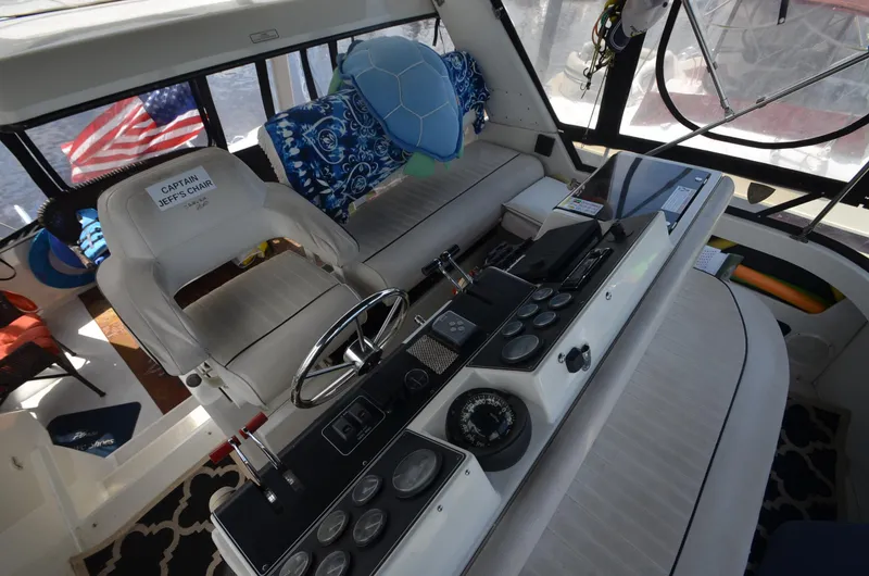 Slide: The Image of Interior helm of 1991 Carver 33 Aft Cabin yacht with steering wheel and navigation instruments. - 6