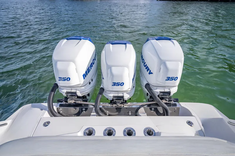 Slide: The Image of Triple Mercury 350 engines on a 2015 Nor-Tech 340 Sport Center Console boat. - 16