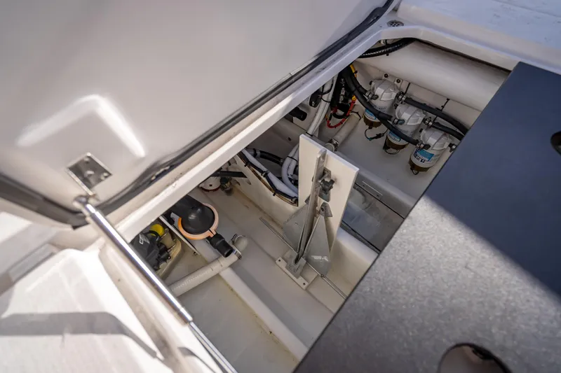 Slide: The Image of 2015 Nor-Tech 340 Sport Center Console engine compartment with visible components and wiring. - 34