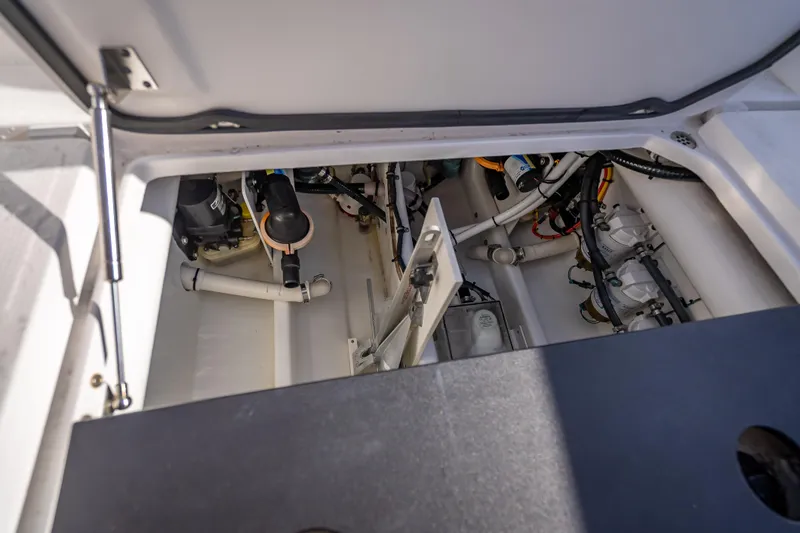 Slide: The Image of Interior view of 2015 Nor-Tech 340 Sport Center Console boat's engine compartment. - 35