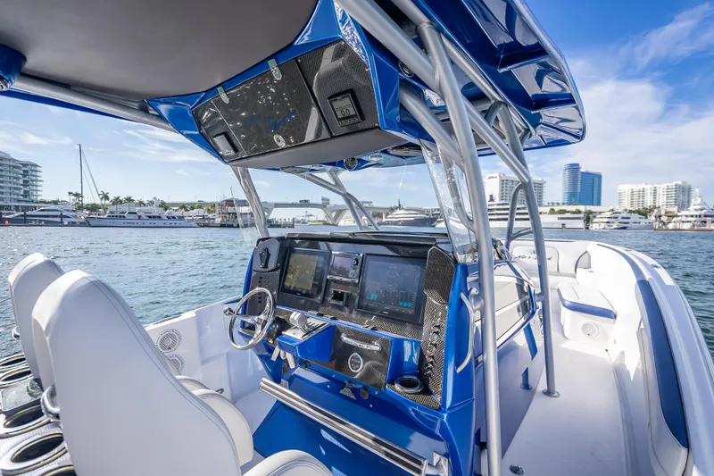 Slide: The Image of 2015 Nor-Tech 340 Sport Center Console boat interior with advanced navigation system. - 36