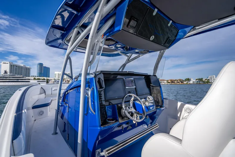 Slide: The Image of 2015 Nor-Tech 340 Sport Center Console boat interior with modern navigation system. - 39