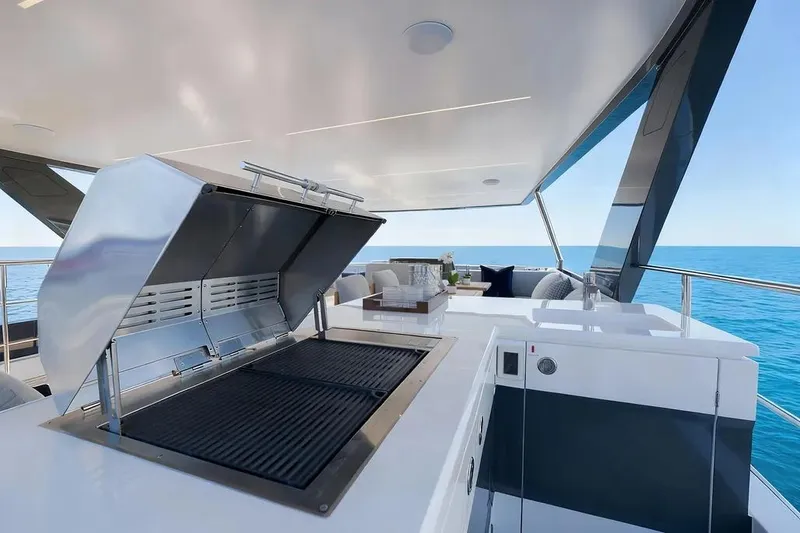 Slide: The Image of Luxury Oceanwalker S60 yacht deck with modern grill, ocean view, and sleek design, 2026 model. - 10