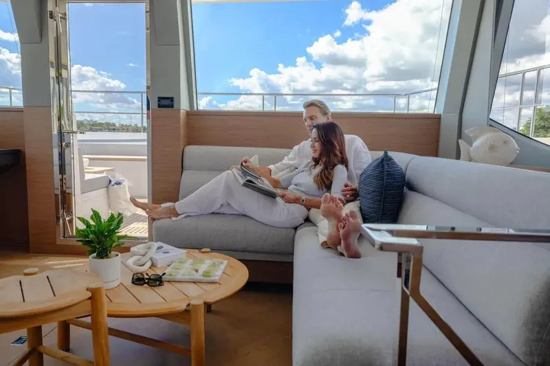 Slide: The Image of Couple relaxing on Oceanwalker S60 yacht, 2026 model, enjoying a sunny day. - 15