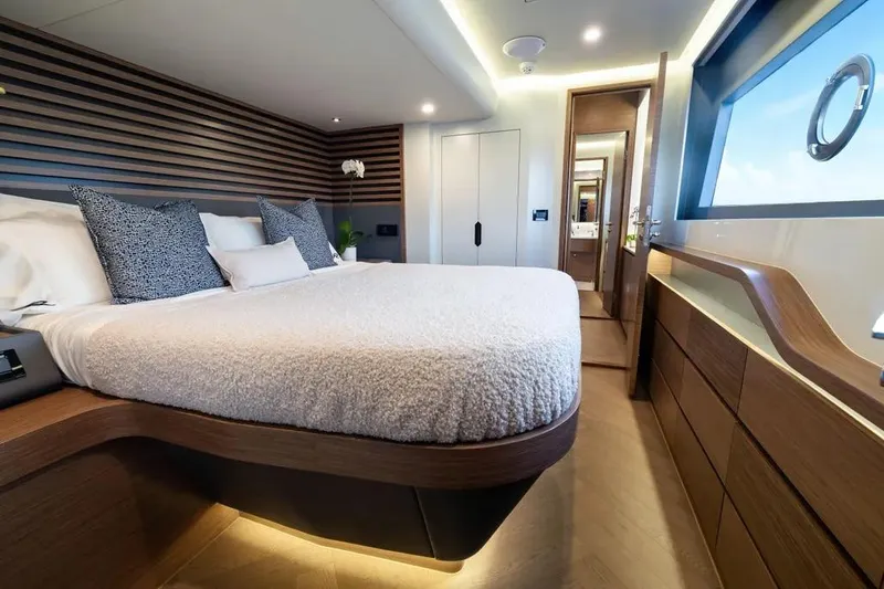 Slide: The Image of Luxurious Oceanwalker S60 yacht bedroom, 2026 model, featuring modern design and elegant wood finishes. - 17
