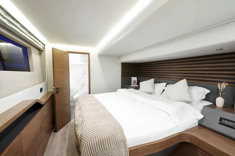 Slide: The Image of Luxurious bedroom interior of 2026 Oceanwalker S60 yacht with modern design and cozy bedding. - 19