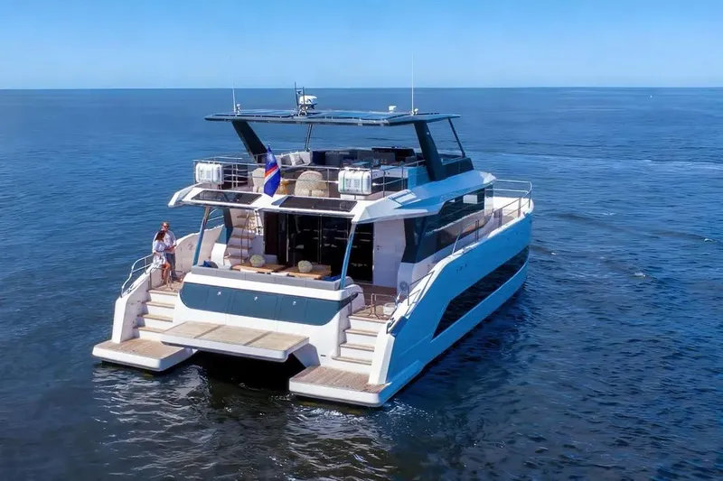 Slide: The Image of Luxurious 2026 Oceanwalker S60 yacht cruising on open sea, featuring modern design and spacious deck. - 2