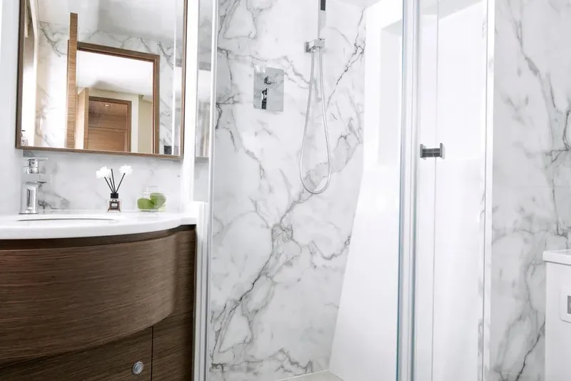 Slide: The Image of Luxurious marble bathroom in Oceanwalker S60 yacht, 2026 model, featuring modern fixtures and elegant design. - 22