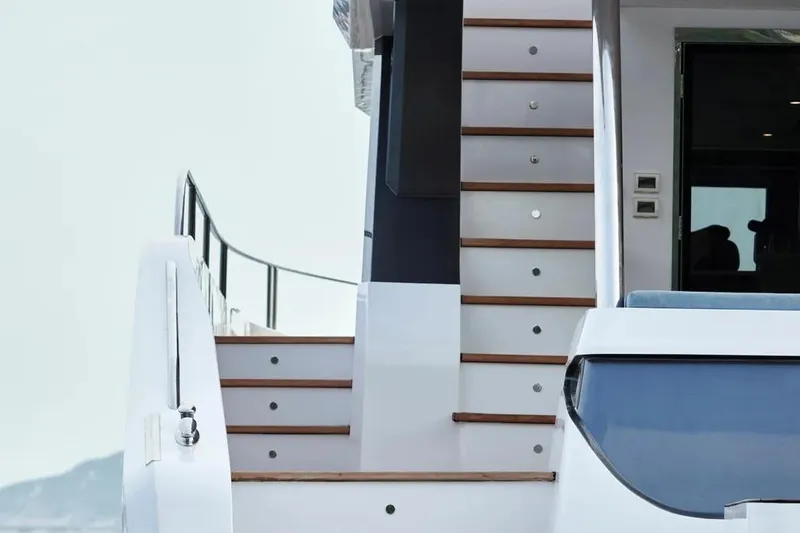 Slide: The Image of Staircase on Oceanwalker S60 yacht, 2026 model, featuring sleek modern design. - 5