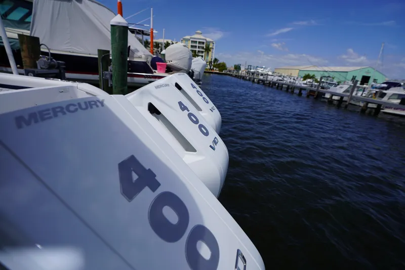 Slide: The Image of 2015 Intrepid 400 Cuddy with Mercury 400 engines docked at marina. - 100