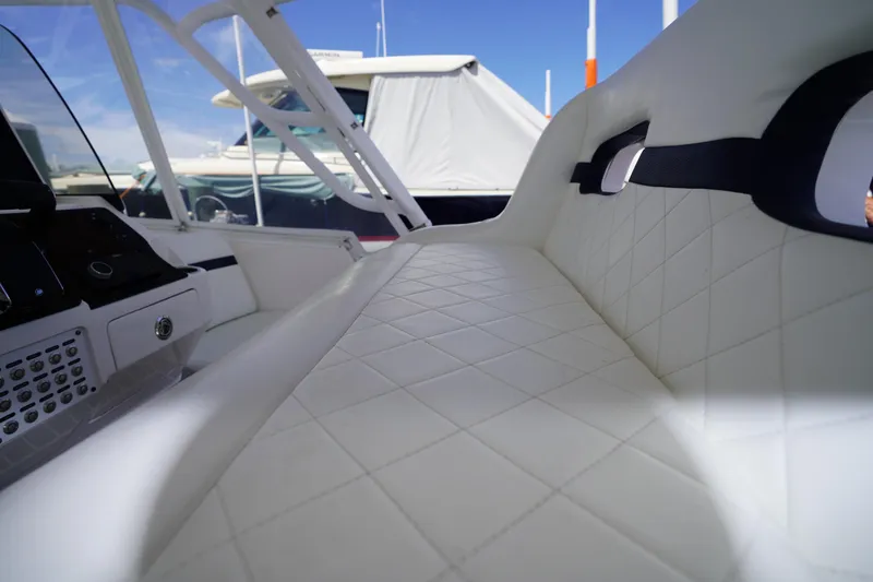 Slide: The Image of Luxurious interior of 2015 Intrepid 400 Cuddy boat with quilted white seating. - 106
