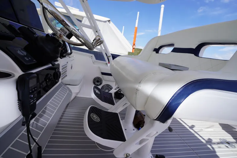Slide: The Image of Interior of 2015 Intrepid 400 Cuddy boat, featuring helm and seating area. - 108