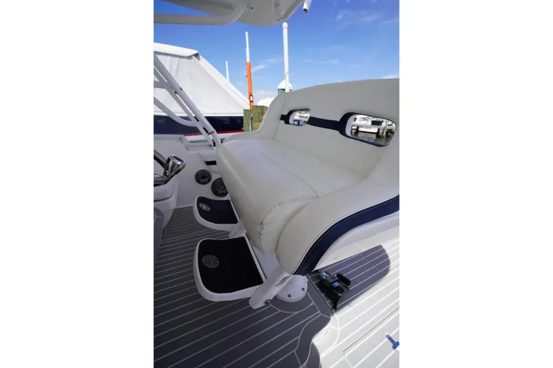 Slide: The Image of Luxurious seating on 2015 Intrepid 400 Cuddy boat, featuring white upholstery and sleek design. - 110