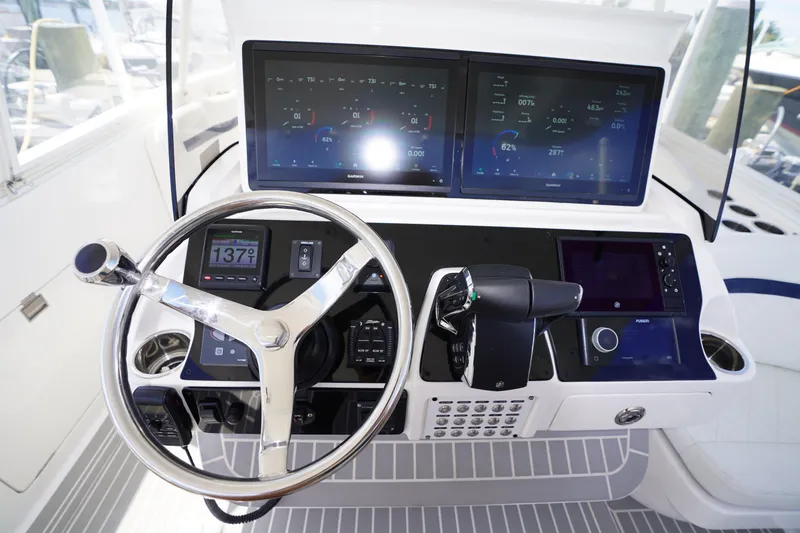 Slide: The Image of Helm of 2015 Intrepid 400 Cuddy with advanced navigation displays and controls. - 116