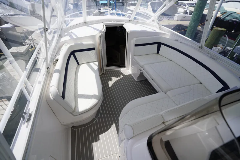 Slide: The Image of Luxurious 2015 Intrepid 400 Cuddy boat interior with white seating and sleek design. - 122
