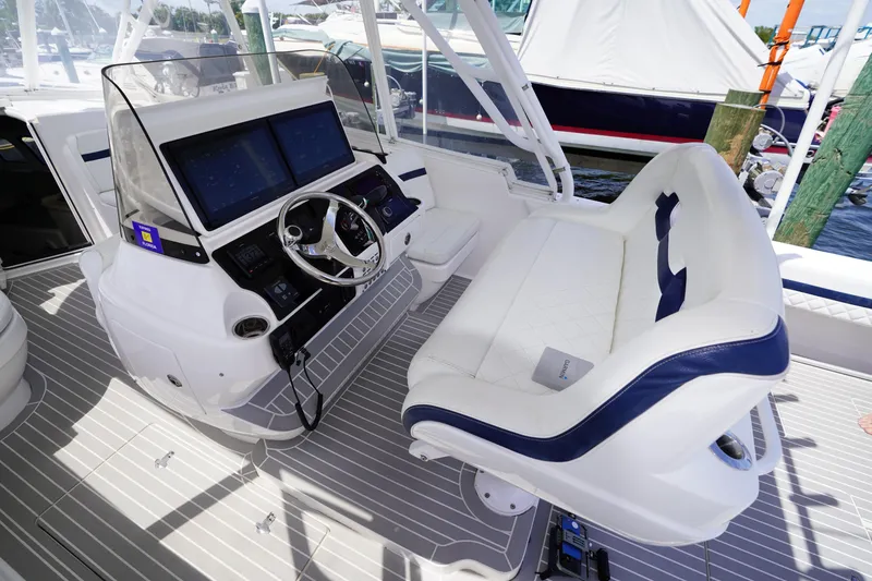 Slide: The Image of 2015 Intrepid 400 Cuddy helm with dual screens and cushioned seating. - 123