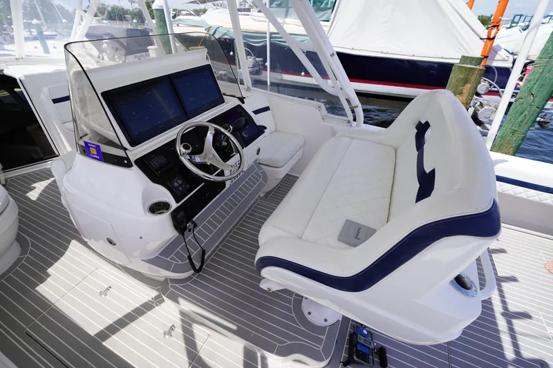 Slide: The Image of 2015 Intrepid 400 Cuddy helm with dual screens and cushioned seating. - 124