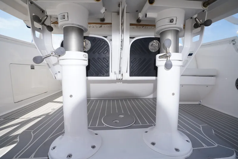 Slide: The Image of 2015 Intrepid 400 Cuddy boat interior with adjustable seating mechanisms and sleek flooring. - 126