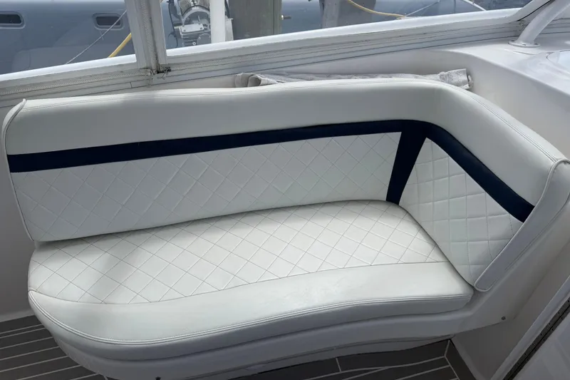 Slide: The Image of White and navy cushioned seating on 2015 Intrepid 400 Cuddy boat. - 20
