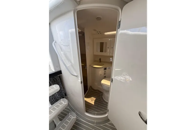 Slide: The Image of 2015 Intrepid 400 Cuddy boat bathroom with modern fixtures and sleek design. - 22