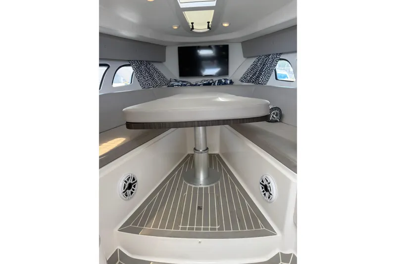 Slide: The Image of Interior of 2015 Intrepid 400 Cuddy boat with table, seating, and windows. - 24
