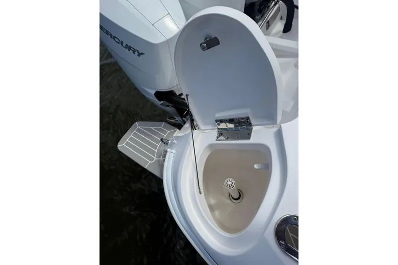 Slide: The Image of Open hatch on 2015 Intrepid 400 Cuddy boat, revealing interior compartment. - 31