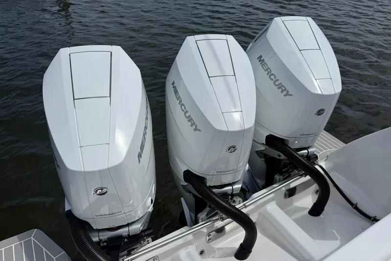 Slide: The Image of Triple Mercury outboard engines on a 2015 Intrepid 400 Cuddy boat. - 32