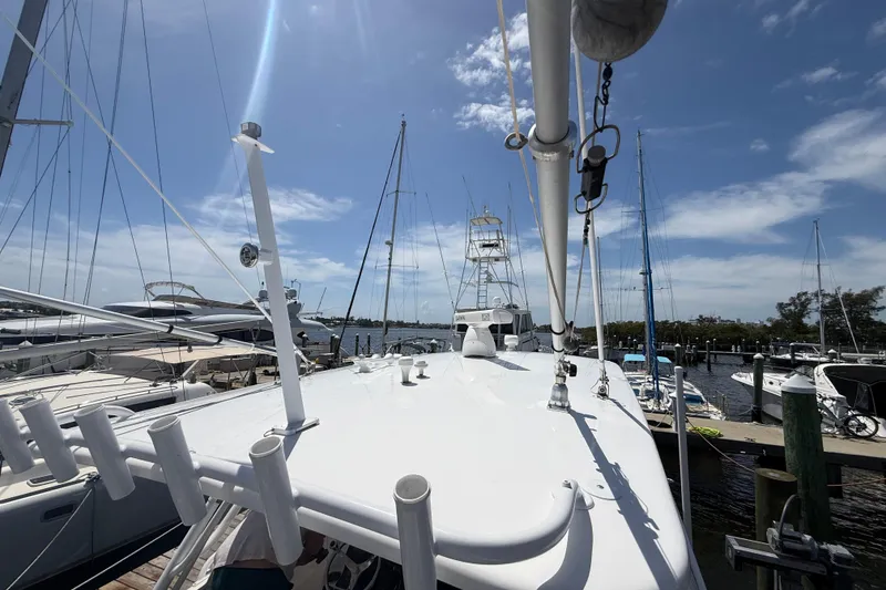 Slide: The Image of 2015 Intrepid 400 Cuddy yacht docked at marina under clear blue sky. - 35