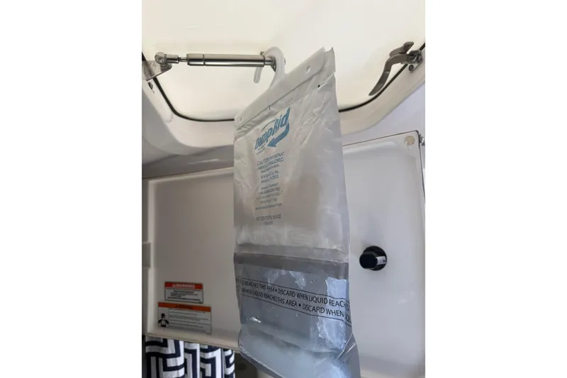 Slide: The Image of Hanging bag inside 2015 Intrepid 400 Cuddy boat cabin, showcasing interior details. - 40