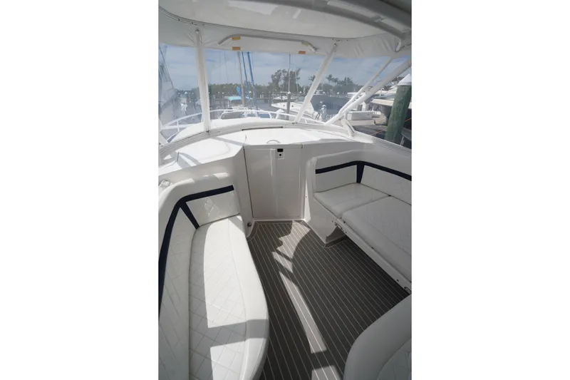 Slide: The Image of 2015 Intrepid 400 Cuddy interior with white seating and striped flooring. - 41