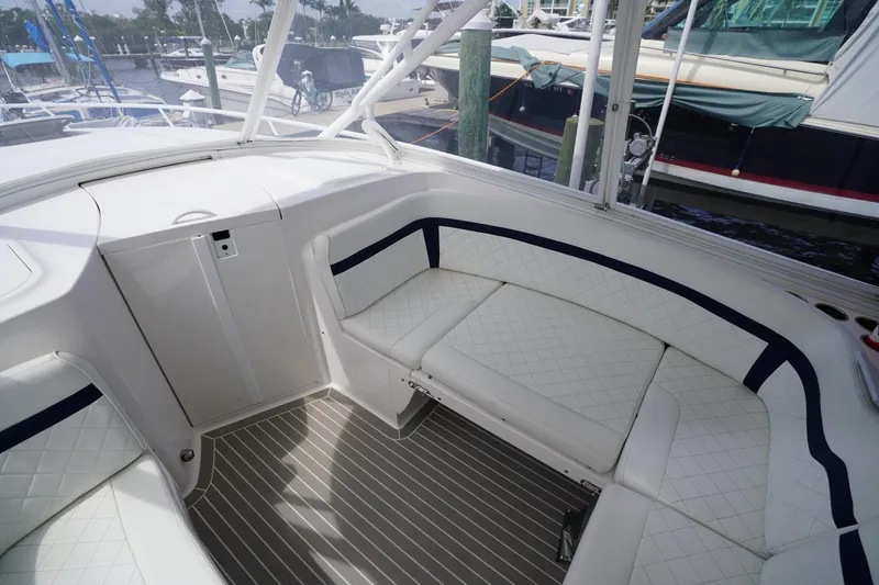 Slide: The Image of Luxurious seating area on a 2015 Intrepid 400 Cuddy boat, docked at a marina. - 42