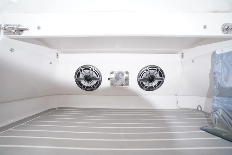 Slide: The Image of Interior of 2015 Intrepid 400 Cuddy boat featuring dual speakers and sleek design. - 44