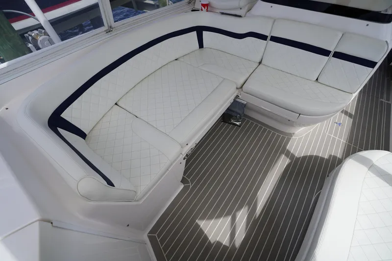 Slide: The Image of Luxurious seating area on a 2015 Intrepid 400 Cuddy boat with white upholstery. - 47