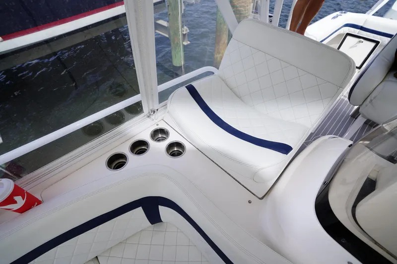 Slide: The Image of Luxurious seating on a 2015 Intrepid 400 Cuddy boat with cup holders and elegant design. - 48