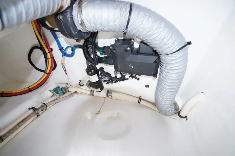 Slide: The Image of Engine compartment of a 2015 Intrepid 400 Cuddy with visible wiring and ventilation. - 54